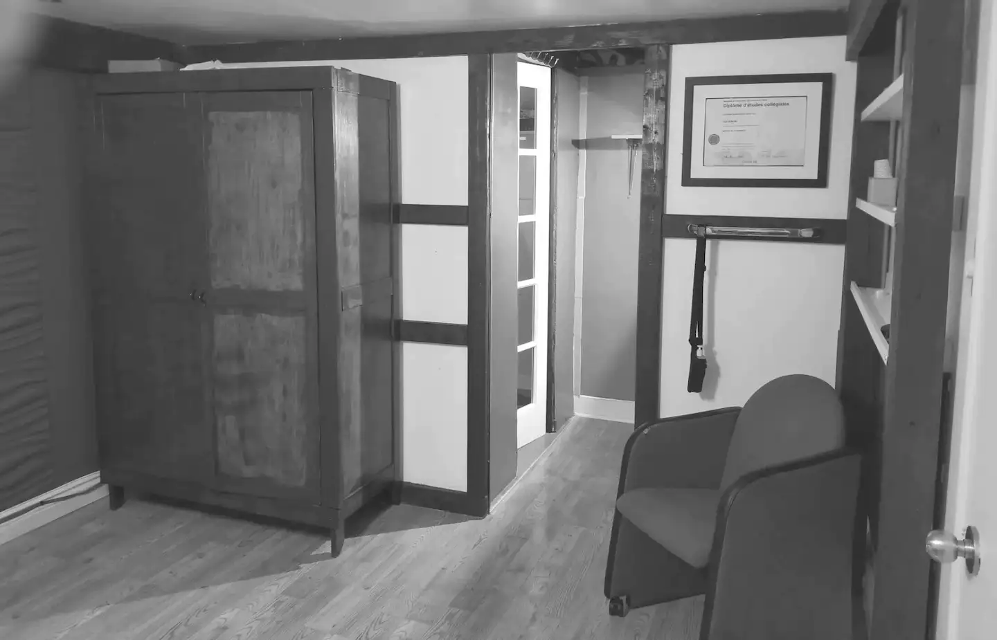 Massage and piercing studio in grey. Interior view of the massage and piercing studio of Yan Dubord Massage Therapist Piercer at Berri-UQAM with a grey color filter.